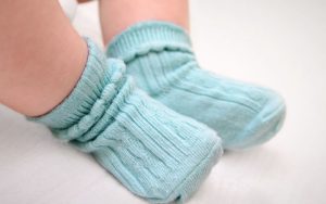 Read more about the article Should I Put Socks on Baby With Fever: Clothing Sense